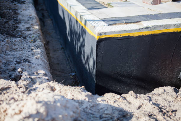 Professional Basement Waterproofing technician working in Washington, KS